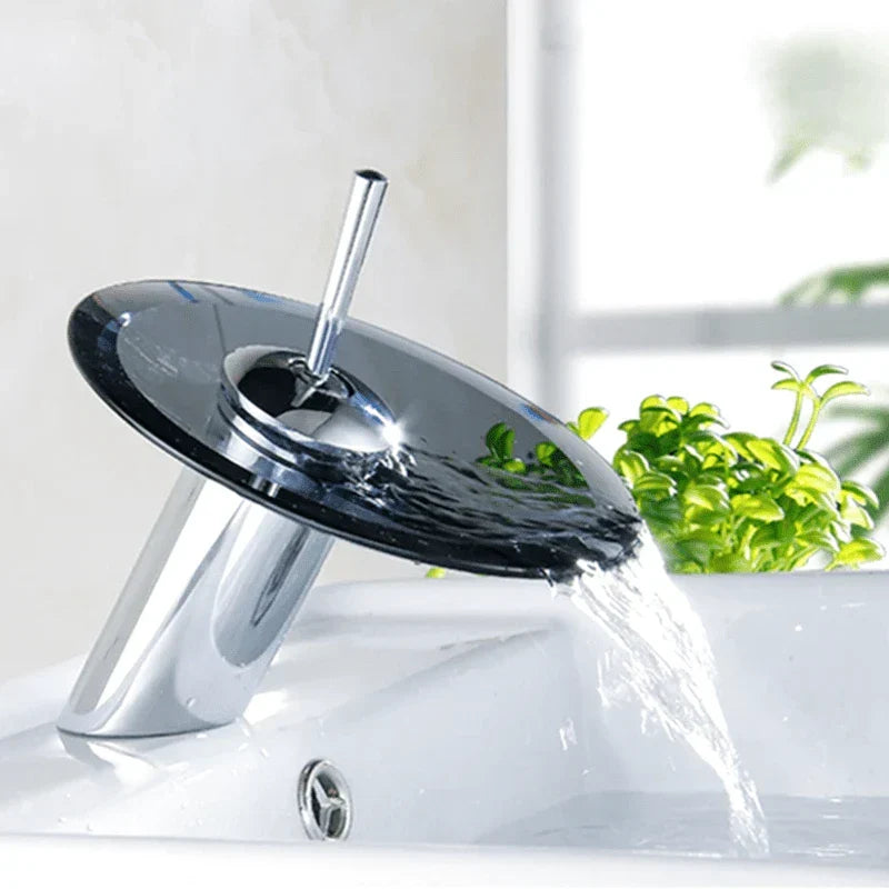 Overview of the black and chrome waterfall faucet on a washbasin