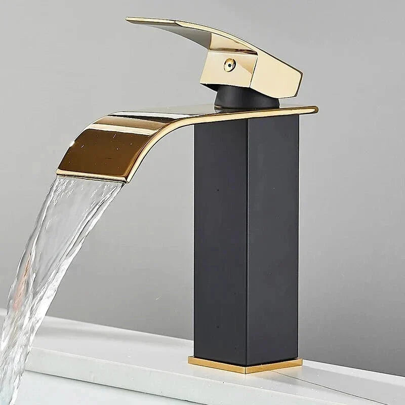 Black and gold bathroom faucet with elegant details