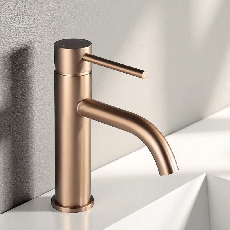 Rose gold brushed stainless steel tap with circular base