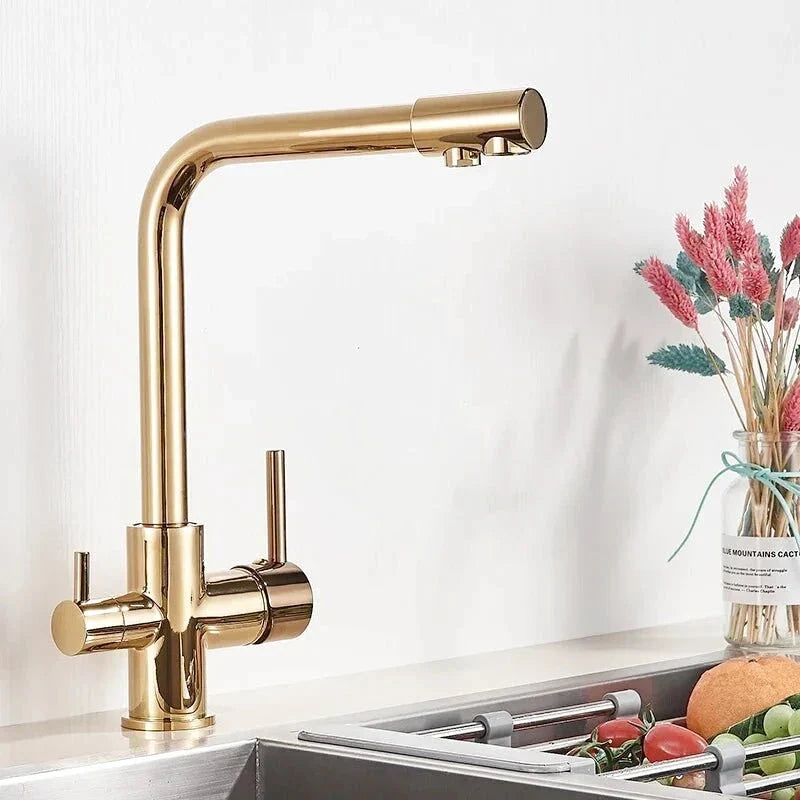 Kitchen faucet with a gold finish, adding a touch of luxury