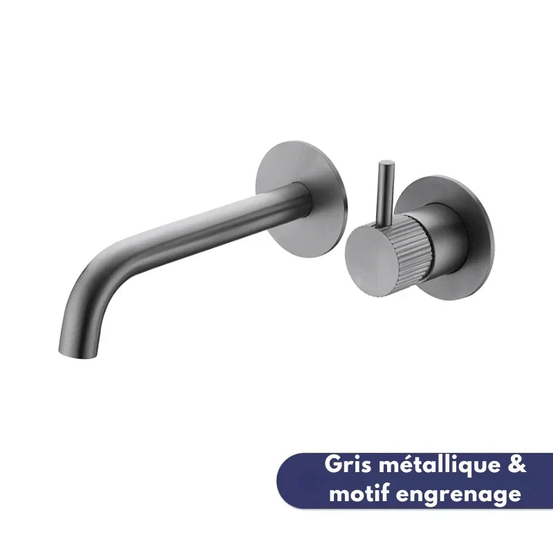 Metallic grey wall-mounted tap with gear pattern, close-up view