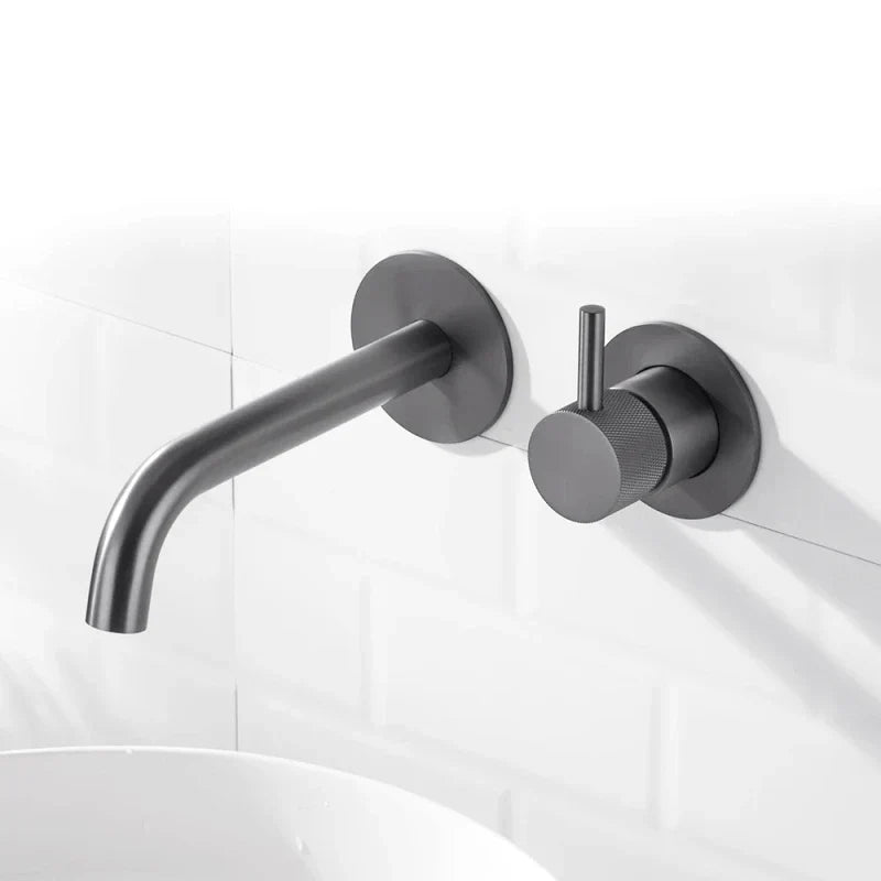 Metallic grey wall-mounted tap, overview with knurled pattern