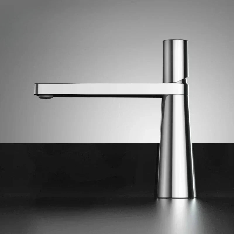 View from below of a black and silver faucet with a modern design