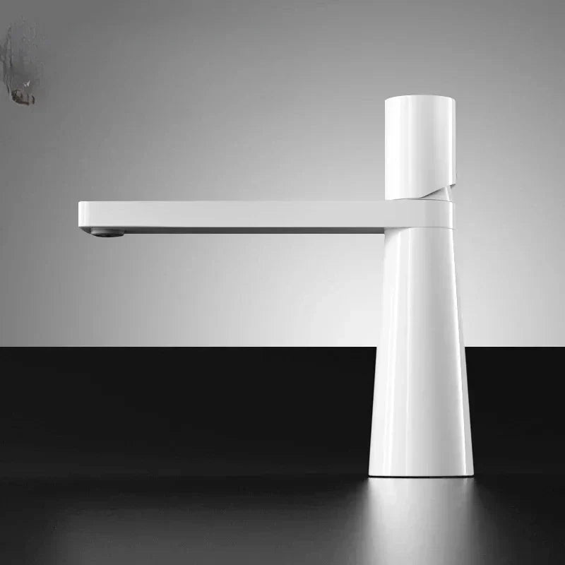 View from below of a black and white faucet with a minimalist design