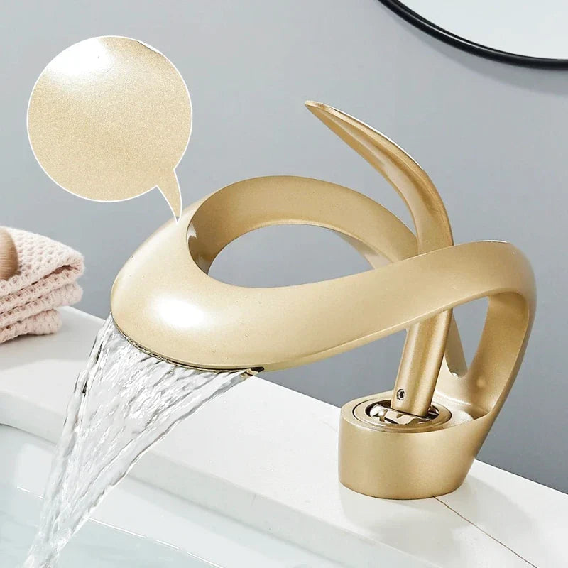 Matte gold faucet with waterfall effect, elegant view
